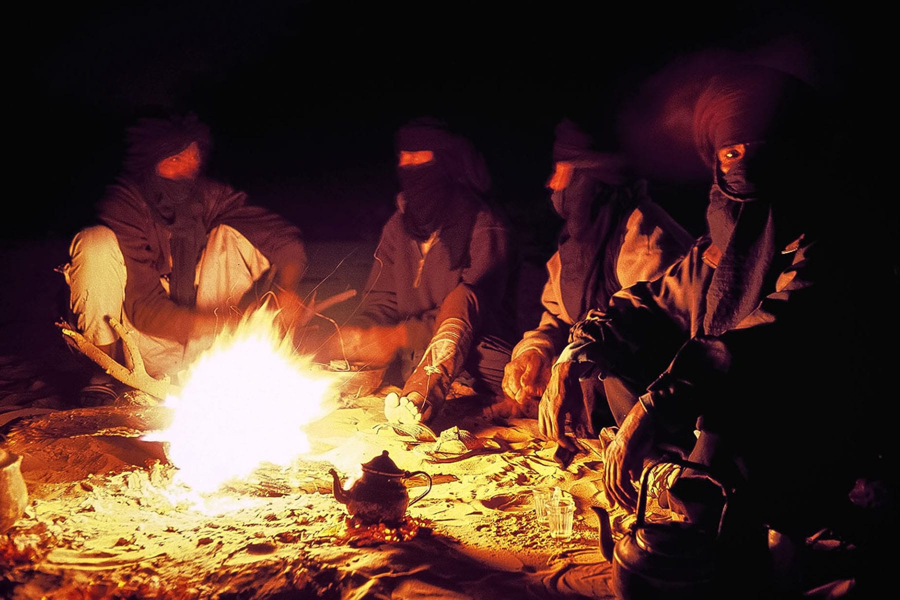 Evening around the campfire under a starry sky 